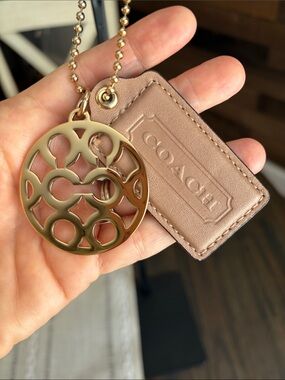 YTK Coach tan Leather Tag Key Charm with Gold Tone Logo Disc